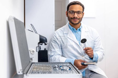 Photo for Doctor at work. Male doctor in lab coat at his working palce - Royalty Free Image