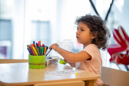 Photo for Drawing. Cute little girl drawing in a play room - Royalty Free Image