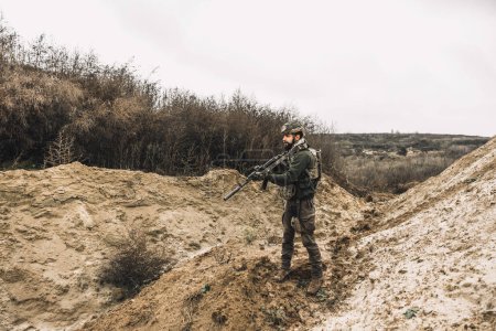 Photo for Shooting range. A soldier with a rifle on a shooting range - Royalty Free Image