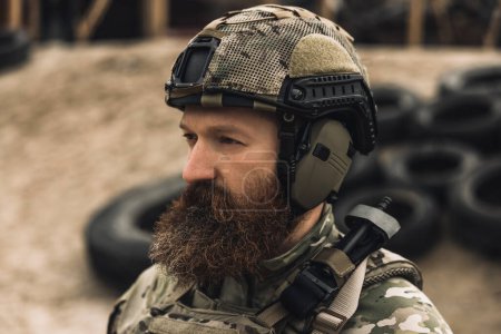 Photo for Warrior. Bearded soldier in military uniform looking determined and serious - Royalty Free Image