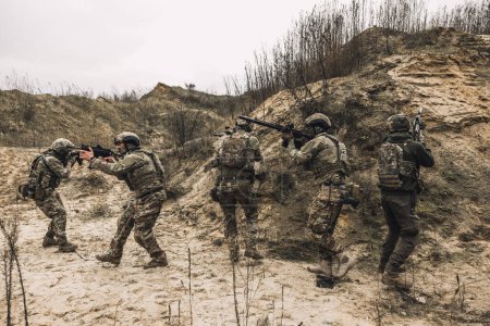 Foto de Soldiers. Soldiers on a shooting range looking concentrated and attentive - Imagen libre de derechos