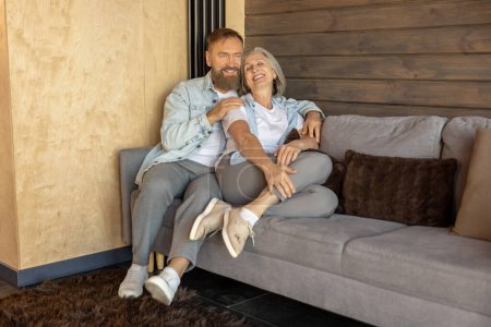 Photo for Time at home. Mature couple peacefully spending time at home together - Royalty Free Image