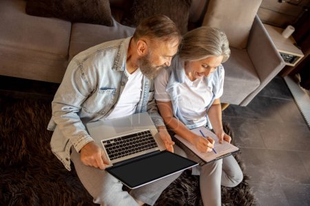 Photo for Online search. Man and woman searching something online on their devices - Royalty Free Image