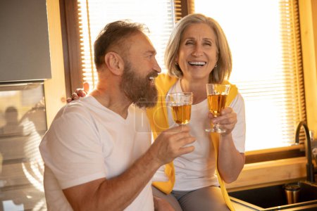 Photo for Glass of wine. Married couple looking enjoyed and happy while having a glass of wine - Royalty Free Image