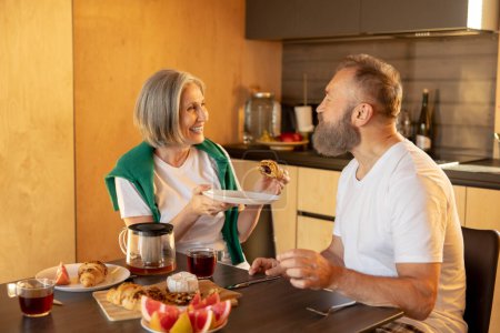 Photo for Breakfast time. Couple having breakfast at home - Royalty Free Image