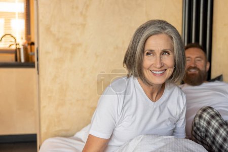 Photo for Closeness. Mature couple staying in bed and feeling close and relaxed - Royalty Free Image