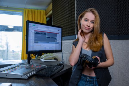 Photo for Music recording. Cute young woman with headphones - Royalty Free Image
