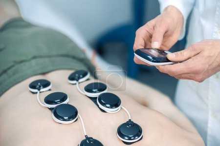 Photo for Back treatment. Close up picture of man having back treatment - Royalty Free Image