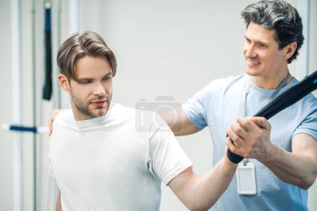 Photo for Limb hyperextension. Physal therapist working with patients limb hyperextension - Royalty Free Image