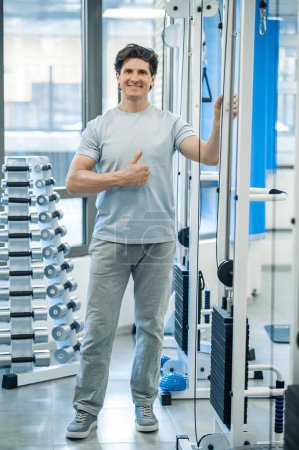 Photo for Physical therapist. Dark-haired smiling physical therapist looking confident - Royalty Free Image