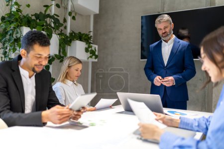 Photo for Business issues. Business partners having negotiations in the office - Royalty Free Image