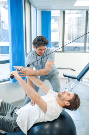 Photo for Rehabilitation. Physical therpaist working with the patient in a rehabilitation center - Royalty Free Image