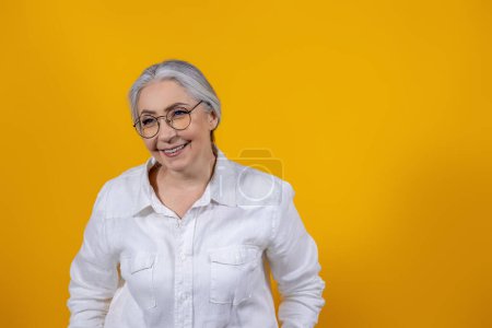 Photo for Positive mood. Positive and determined senior woman in light shirt - Royalty Free Image