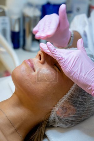 Photo for Dermatology, cosmetology, health care, skin care procedure in a beauty spa salon. - Royalty Free Image