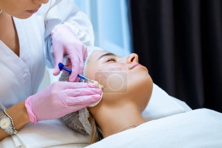 Photo for Unrecognizable cosmetologist doing PRP ttherapy in beauty clinic, making injection, anti aging procedures. - Royalty Free Image