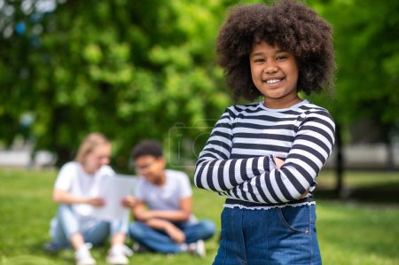 Photo for Happy. Smiling curly-haired african american teen looking happy - Royalty Free Image