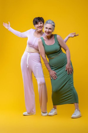 Photo for Smiling women. Senior well-groomed women feeling excited and smiling - Royalty Free Image