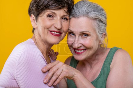 Photo for Women. Active senior women standing close and smiling happily - Royalty Free Image