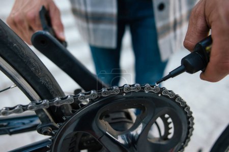 Photo for Fixing a problem. Close up of mans hands repairing a bike - Royalty Free Image