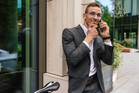 Photo for Phone call. Handsome young businessman talking on the phone - Royalty Free Image