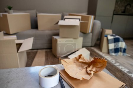 Photo for Relocation. Containers with home stuff in a room before relocation - Royalty Free Image