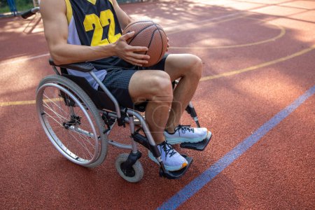 Photo for Unrecognizable basketball player man in wheelchair with a disability on court. - Royalty Free Image