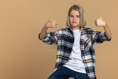 Photo for Girl in a studio. Teen girl in a plaid shirt in a studio - Royalty Free Image