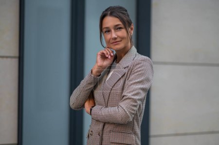 Photo for Successful beautiful business woman in suit near modern office building. - Royalty Free Image