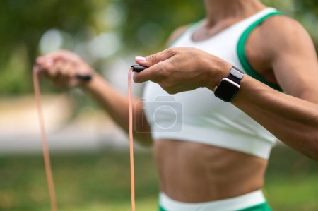 Photo for Workout. Close up of a woman holding a fitness band - Royalty Free Image