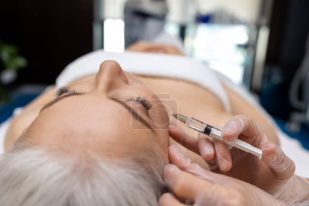 Photo for Anti age skin treatment. Female patient having anti age treatment at cosmetologist - Royalty Free Image