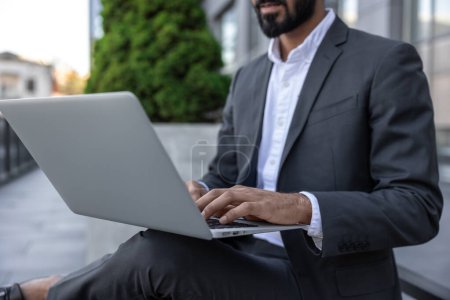 Photo for Close up of a businessman working on laptop - Royalty Free Image