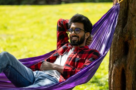 Photo for Man in hammock looking relaxed and contented - Royalty Free Image