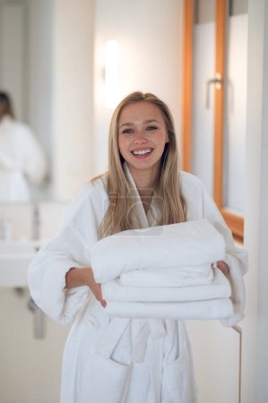 Photo for Girl with towels. Young woman with towels smiling and looking contented - Royalty Free Image