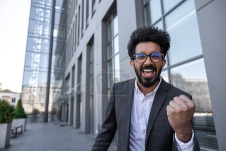 Photo for Young hindu businessman feeling excited and happy - Royalty Free Image