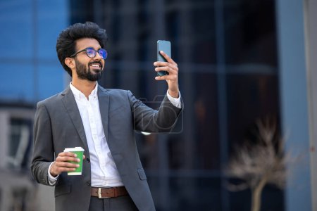 Photo for Elegant hindu young man with a phone in hands - Royalty Free Image