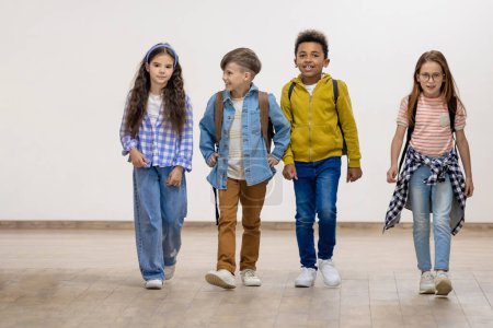 Photo for Group of school kids walking in corridor. Education, elementary school, children during break. - Royalty Free Image
