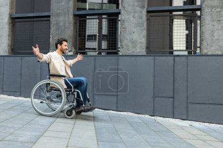 Photo for Feeling excited. Young man on a wheelchair feeling free and excited - Royalty Free Image