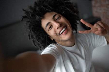 Selfie. Close up of a smiling young man making selfie
