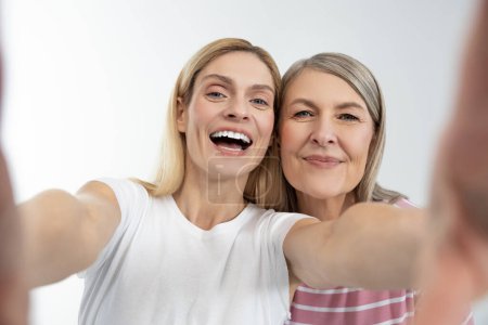 Photo for Happy ladies. Mother and daughter having good time together and looking happy - Royalty Free Image