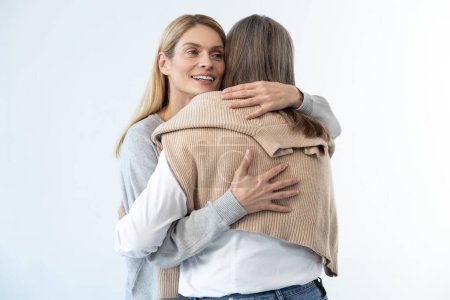Photo for Happy daughter. Blonde woman hugging her mom and looking happy - Royalty Free Image