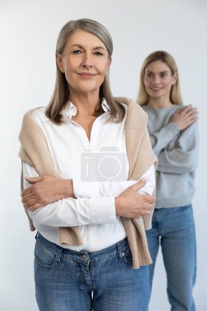 Photo for Women. Good-looking mature well-groomed woman with her daughter - Royalty Free Image