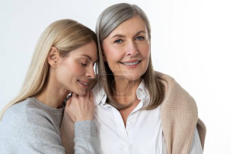 Photo for Mom and daughter. Two women standing close and looking peaceful and relaxed - Royalty Free Image