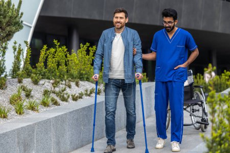 Photo for Nurse and patient. Make nurse and a man with sticks on a walk - Royalty Free Image