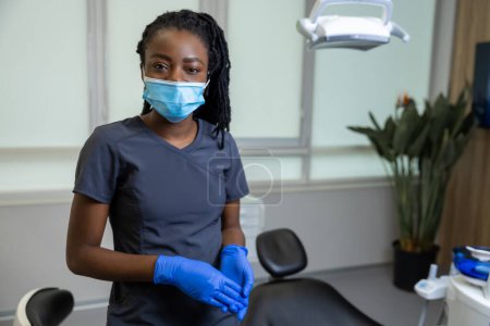 Photo for African american female dentist standing in her office - Royalty Free Image