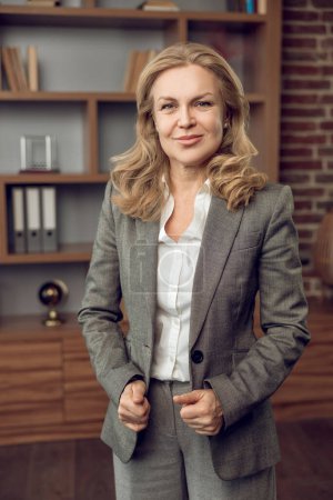 Photo for Blonde confident female psychologist in formal wear in modern office - Royalty Free Image