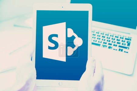 Photo for SharePoint allows users to store, organize, and share documents, ensuring version control and document history tracking - Royalty Free Image