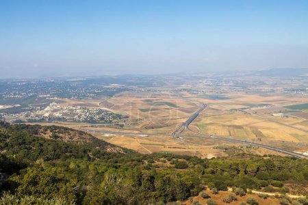 Photo for View of the Jezreel Valley in fog in winter cloudy day from Muhraqa on Mount Carmel in Lower Galilee, Israel - Royalty Free Image
