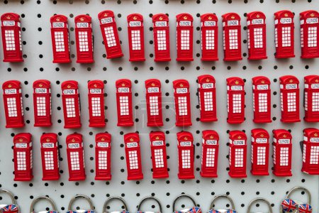 Photo for London,UK -18 April 2023, Souvenir fridge magnets a red telephone booth - Royalty Free Image