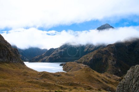 Photo for Cloud shrouded mountains and Lake Harris, Routeburn Track Harris Saddle,  New Zealand - Royalty Free Image