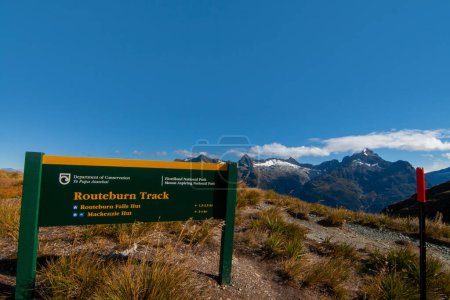 Photo for Information signpost at the Harris Saddle on Routeburn Track Great Walk, scenic view of Darran Mountains and Hollyford Valley, New Zealand - Royalty Free Image